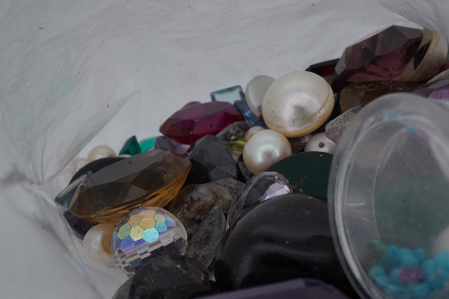 A bag of loose stones, including amethysts, garnets, cultured pearls, a quantity of small diamonds and rubies, jadeite beads, a green chrysoprase intaglio depicting the cathedral of St Stephen, Vienna, and various synthe